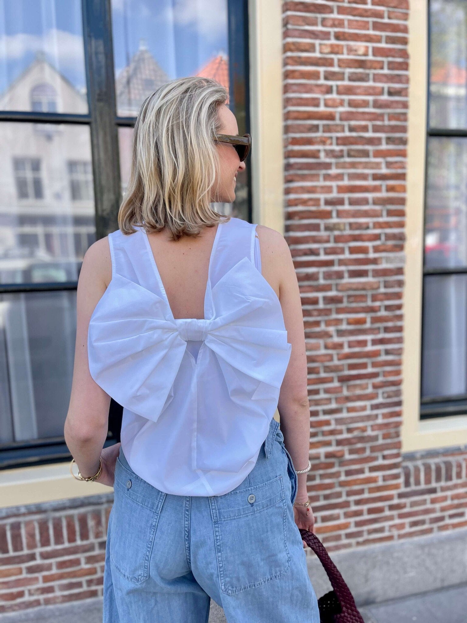 Bow blouse with cargo pant look